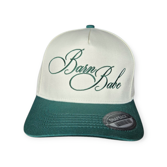 This is a Barn Babe V1 structured hat in dark green beige with a dark green embroidered design on the front panel, facing forward.