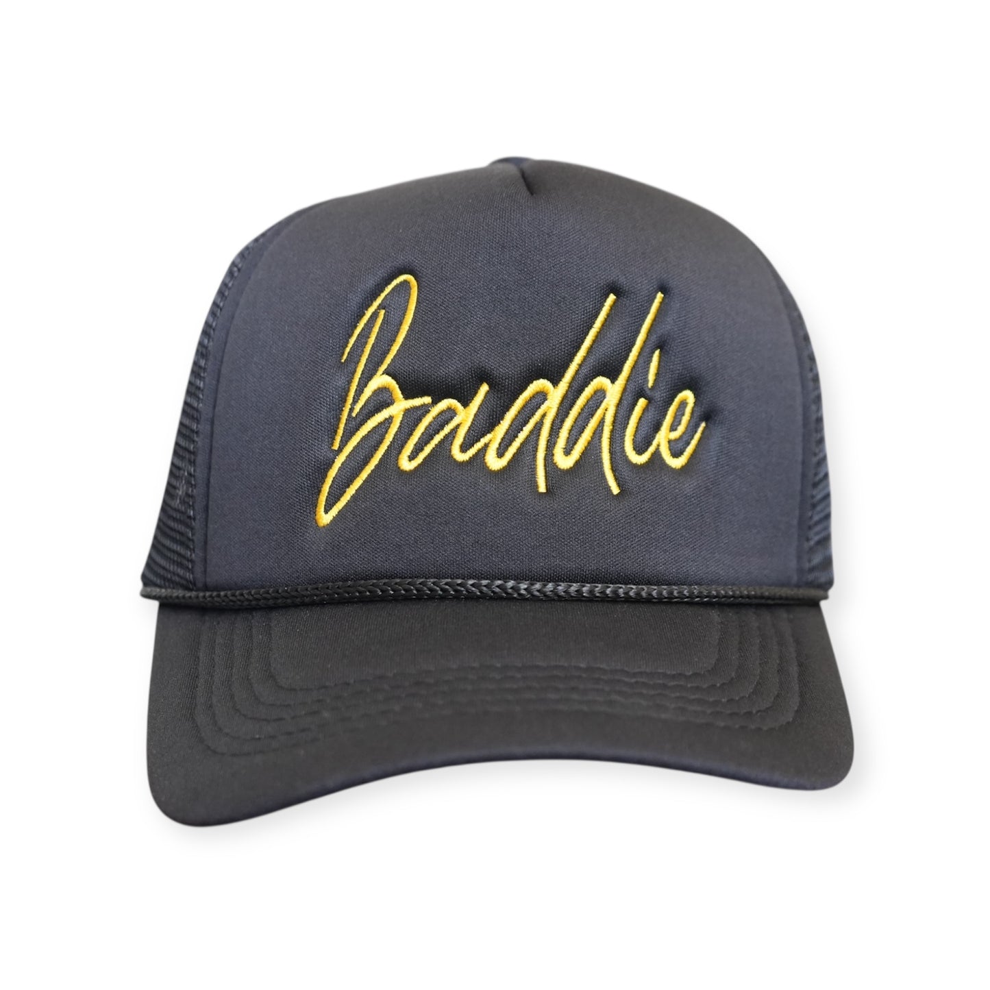 This is a Baddie V1 trucker hat in black with a gold embroidered design on the front panel, facing forward.