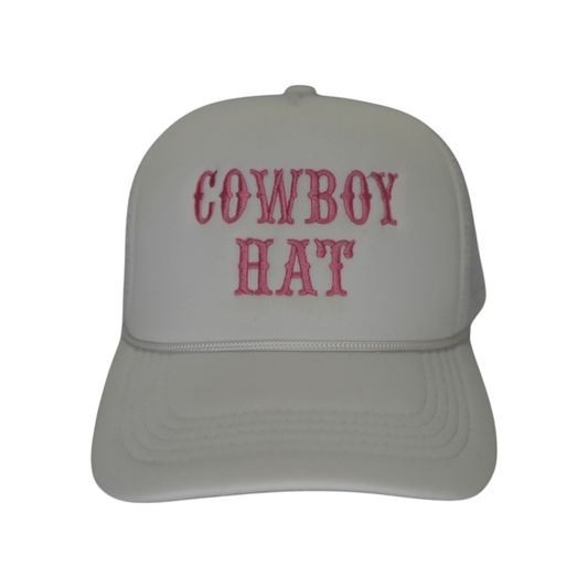 Front-facing white polyester trucker snapback hat with a curved brim and “Cowboy Hat” embroidered in pink thread in two stacked lines across the front.