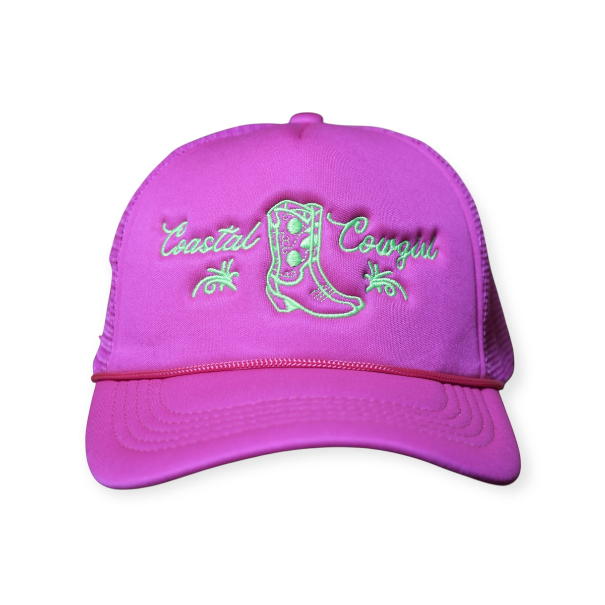Front-facing Coastal Cowgirl V1 trucker snapback hat in bright pink, featuring “Coastal Cowgirl” and a western boot embroidered in neon green.