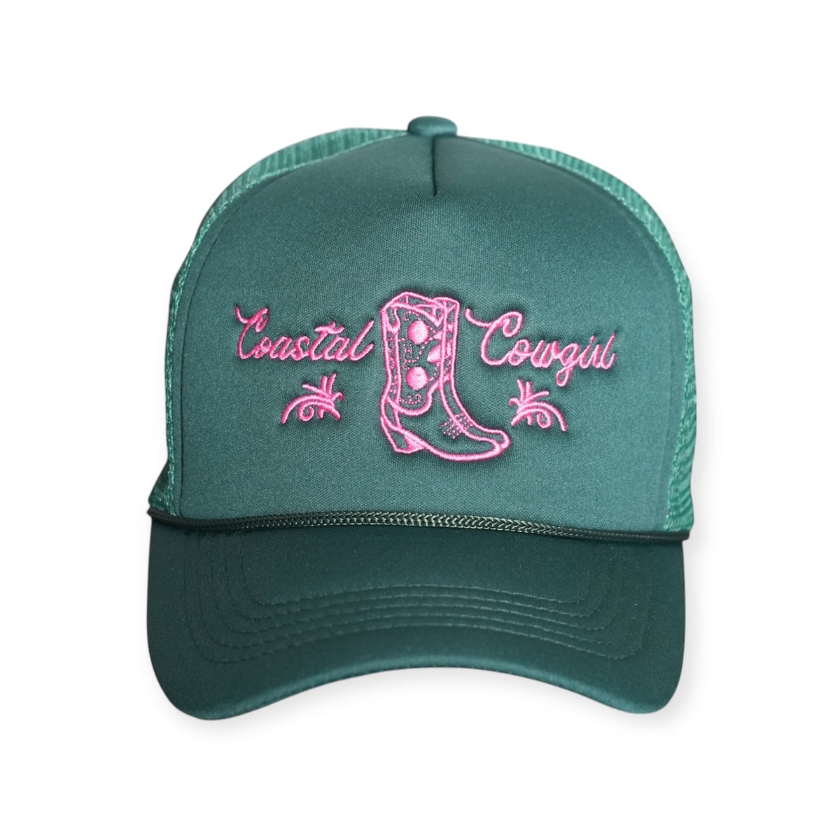 Front-facing Coastal Cowgirl V1 trucker snapback hat in forest green, featuring “Coastal Cowgirl” and a western boot embroidered in pink.