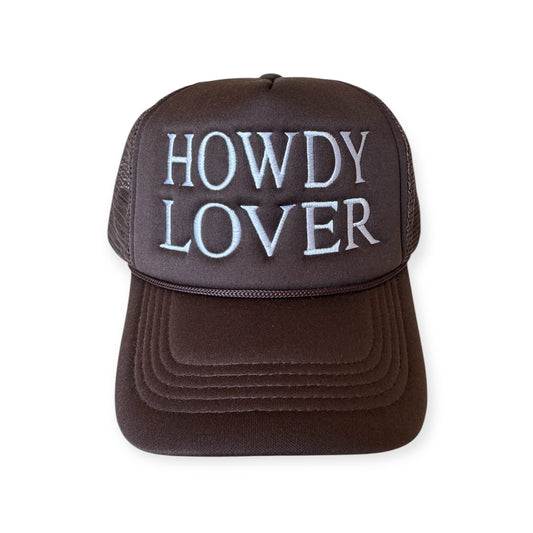 Dark brown trucker hat with “Howdy Lover” embroidered across the front in white thread